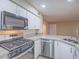 Well-equipped kitchen featuring stainless steel appliances, granite countertops, and ample cabinet space at 713 Wheat Ridge Ln # 102, Las Vegas, NV 89145