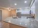 Modern kitchen showcasing granite countertops, stainless steel appliances, and ample cabinet space at 713 Wheat Ridge Ln # 102, Las Vegas, NV 89145