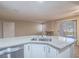 Elegant kitchen island with granite countertops and sink, perfect for cooking and socializing at 713 Wheat Ridge Ln # 102, Las Vegas, NV 89145