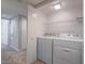 Functional laundry room with washer and dryer included, simplifies laundry chores at 713 Wheat Ridge Ln # 102, Las Vegas, NV 89145
