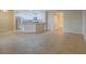 Open-concept living space with an eat-in kitchen and tile flooring throughout at 713 Wheat Ridge Ln # 102, Las Vegas, NV 89145
