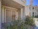 Relaxing patio with lush foliage creates a peaceful outdoor living space at 713 Wheat Ridge Ln # 102, Las Vegas, NV 89145
