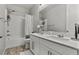 This bathroom has a double sink vanity and a shower/tub combo at 7456 Tinley Creek Ave, Las Vegas, NV 89113