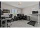 This large home office features dual desk spaces and plenty of natural light at 7456 Tinley Creek Ave, Las Vegas, NV 89113