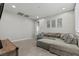 Comfortable living room features a plush sectional sofa and neutral decor at 7456 Tinley Creek Ave, Las Vegas, NV 89113
