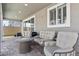 Inviting covered patio featuring comfortable seating and a cozy fire pit, perfect for outdoor relaxation at 7456 Tinley Creek Ave, Las Vegas, NV 89113