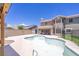 Backyard featuring a large pool, covered patio, and a spacious yard at 747 Canyon Crest Dr, Las Vegas, NV 89123