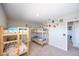 Bedroom with wall decals and triple bunk beds at 747 Canyon Crest Dr, Las Vegas, NV 89123
