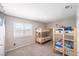 Bedroom with wall decals and triple bunk beds at 747 Canyon Crest Dr, Las Vegas, NV 89123