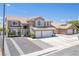 Charming two story house with tile roof and three-car garage at 747 Canyon Crest Dr, Las Vegas, NV 89123