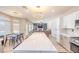Open-concept design connects the kitchen, dining area, and living room, creating a versatile space for entertaining guests at 747 Canyon Crest Dr, Las Vegas, NV 89123
