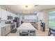 Modern kitchen with stainless steel appliances, large island with breakfast bar, and sleek countertops offers style and functionality at 747 Canyon Crest Dr, Las Vegas, NV 89123
