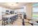 Bright kitchen features white and gray cabinetry, a spacious island, and stainless steel appliances, perfect for cooking and entertaining at 747 Canyon Crest Dr, Las Vegas, NV 89123