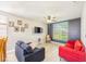 Cozy living room featuring modern furniture, a ceiling fan, a TV, and a view of the backyard at 747 Canyon Crest Dr, Las Vegas, NV 89123