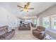 Well-lit living room with wood-look floors and view of the open concept design at 747 Canyon Crest Dr, Las Vegas, NV 89123