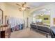 Spacious living room with archway, ceiling fan, and carpet, showcasing open-concept design at 747 Canyon Crest Dr, Las Vegas, NV 89123