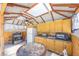 Outdoor kitchen featuring wood cabinets, stainless steel appliances, and a ceiling fan at 747 Canyon Crest Dr, Las Vegas, NV 89123