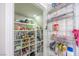 Well-organized walk-in pantry with ample shelving and storage for groceries and household items at 747 Canyon Crest Dr, Las Vegas, NV 89123