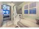 Enjoy a relaxing bath in this bathroom featuring a tiled shower and bath at 7908 Horse Bridle St, Las Vegas, NV 89131