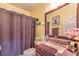Bathroom includes a shower with curtain, a sink with vanity and pink accessories at 7908 Horse Bridle St, Las Vegas, NV 89131