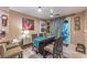Charming dining area with a high-top table, stylish decor, and a view to the backyard at 7908 Horse Bridle St, Las Vegas, NV 89131
