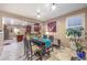 Bright dining area featuring a high-top table, a view into the kitchen, and ample natural light at 7908 Horse Bridle St, Las Vegas, NV 89131
