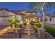 Beautiful two-story home with landscaped front yard, stone walkway, and charming curb appeal at twilight at 7908 Horse Bridle St, Las Vegas, NV 89131