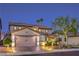 Inviting two-story home showcasing a manicured lawn, brick driveway, and vibrant landscaping at 7908 Horse Bridle St, Las Vegas, NV 89131