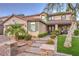 Charming two-story stucco home with landscaped yard, desert landscaping, and covered front porch at 7908 Horse Bridle St, Las Vegas, NV 89131