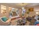 Inviting living room with a staircase view, stylish decor, and comfortable seating arrangement at 7908 Horse Bridle St, Las Vegas, NV 89131