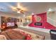 Spacious living room featuring a comfortable sectional, decorative wall art, and an open staircase at 7908 Horse Bridle St, Las Vegas, NV 89131