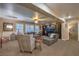 Relax in this spacious living room featuring neutral walls, ceiling fan and entertainment center at 7908 Horse Bridle St, Las Vegas, NV 89131