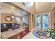 Open concept living room featuring hardwood floors, elegant decor, and plenty of natural light at 7908 Horse Bridle St, Las Vegas, NV 89131