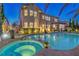 Lush backyard featuring a large pool, spa, and outdoor seating area, perfect for entertaining at 7908 Horse Bridle St, Las Vegas, NV 89131