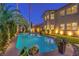 Gorgeous backyard oasis with a sparkling pool, mature landscaping, and manicured lawn at 7908 Horse Bridle St, Las Vegas, NV 89131