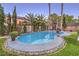 Inviting backyard pool and spa surrounded by manicured landscaping, perfect for outdoor relaxation at 7908 Horse Bridle St, Las Vegas, NV 89131