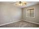 Neutral bedroom with carpet, ceiling fan and a single window for a calm and restful space at 8340 Jeremiahs Lodge Ave, Las Vegas, NV 89131