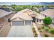 Charming single-Gathering home featuring a well-maintained yard, three-car garage, and desert landscaping at 8340 Jeremiahs Lodge Ave, Las Vegas, NV 89131