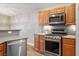 Modern kitchen featuring stainless steel appliances, light wood cabinets, and tile floors at 8340 Jeremiahs Lodge Ave, Las Vegas, NV 89131