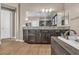 Bright bathroom boasts a double vanity, a soaking tub, and a large mirror at 9091 Becket Ranch Ct, Las Vegas, NV 89113