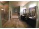 Elegant bathroom with dual vanities, a soaking tub, and a separate glass-enclosed shower, providing a luxurious retreat at 9900 Summer Ash Ct # 101, Las Vegas, NV 89134