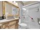 Bathroom featuring a classic vanity, toilet, and glass-enclosed shower with a shower seat at 9900 Summer Ash Ct # 101, Las Vegas, NV 89134