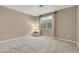 Neutral bedroom with a large window letting in plenty of natural light at 9900 Summer Ash Ct # 101, Las Vegas, NV 89134