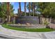 Landscaped community sign, 'Summer Trail', with palm trees and desert plants at 9900 Summer Ash Ct # 101, Las Vegas, NV 89134