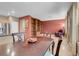 Open concept dining and living rooms feature built-in shelving and tile floors at 9900 Summer Ash Ct # 101, Las Vegas, NV 89134