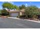 Well-maintained home with two-car garage, mature shrubs, and a tile roof at 9900 Summer Ash Ct # 101, Las Vegas, NV 89134