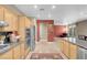 Modern kitchen with stainless appliances, breakfast bar, and granite counters at 9900 Summer Ash Ct # 101, Las Vegas, NV 89134