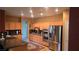 Modern kitchen with stainless steel appliances, granite countertops, and wooden cabinets, providing a functional and stylish space at 9900 Summer Ash Ct # 101, Las Vegas, NV 89134