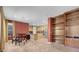 A spacious kitchen features modern appliances, a breakfast bar, and an adjacent dining area with ample natural light at 9900 Summer Ash Ct # 101, Las Vegas, NV 89134