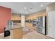 Traditional kitchen with stainless appliances, granite counters, and tile floors at 9900 Summer Ash Ct # 101, Las Vegas, NV 89134
